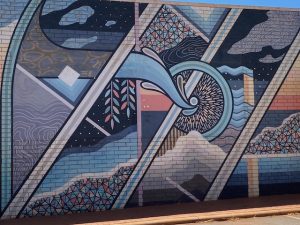 Street art with a jigsaw of images .