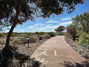 The Turquoise Way path sealed with info signs.
